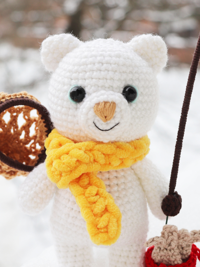 polar bear crochet with scarf in the snow
