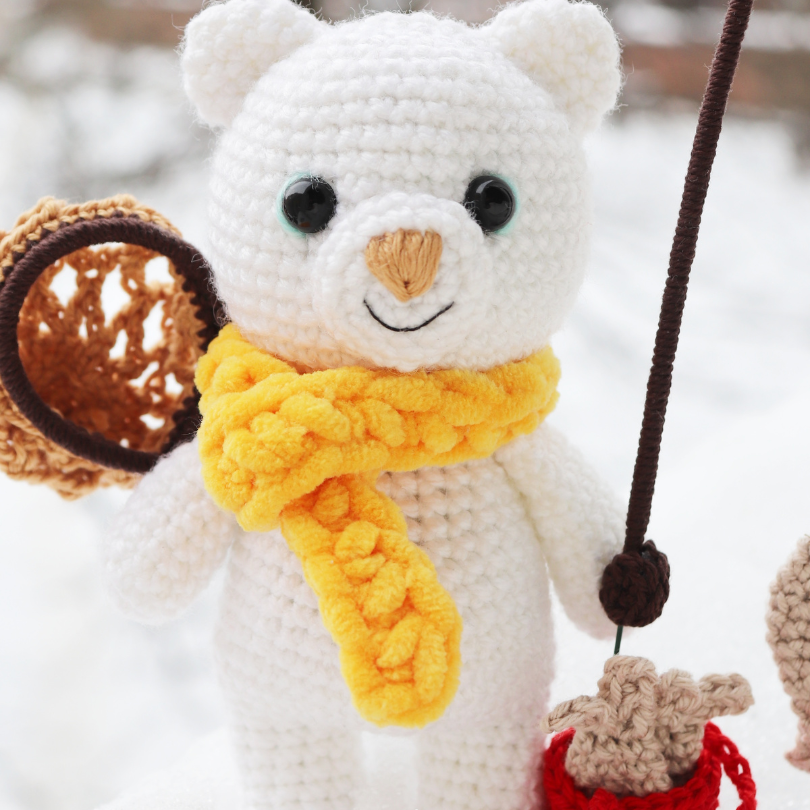 polar bear crochet with scarf in the snow